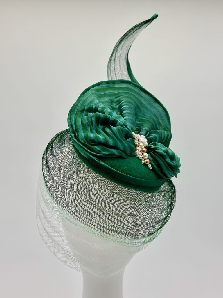 Autumn winter racewear green felt with pleated silk shibori and Swarovski pearl beading with crinoline veil and feathers by Australian milliner / Sydney milliner / hat maker, Abigail Fergusson Millinery