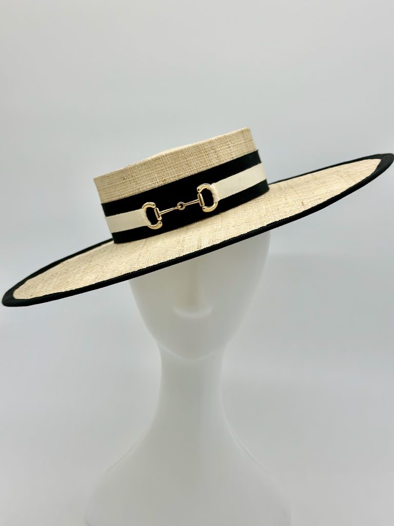 Polo In the city Urban Polo Spring Racing Millinery Racewear A natural raffia boater hat with black and ivory hatband with gold horse saddle bit trim Designed and handmade in Sydney, Australia by Abigail Fergusson Millinery.