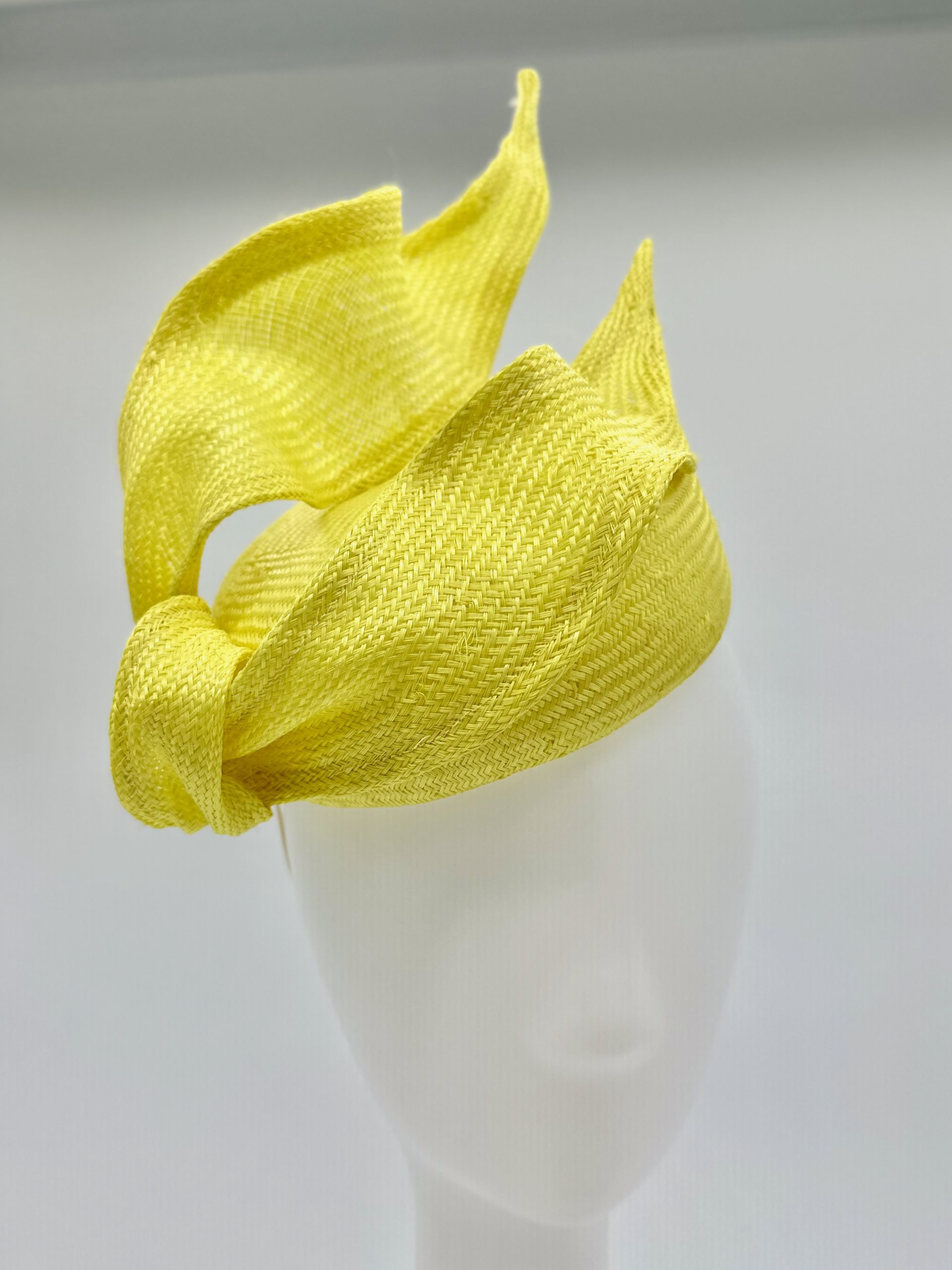 Spring Racing Millinery Racewear canary yellow parasisal straw duchess shaped cocktail hat with sculpted straw knot trim by Sydney Milliner Australian Milliner Hatmaker Abigail Fergusson Millinery