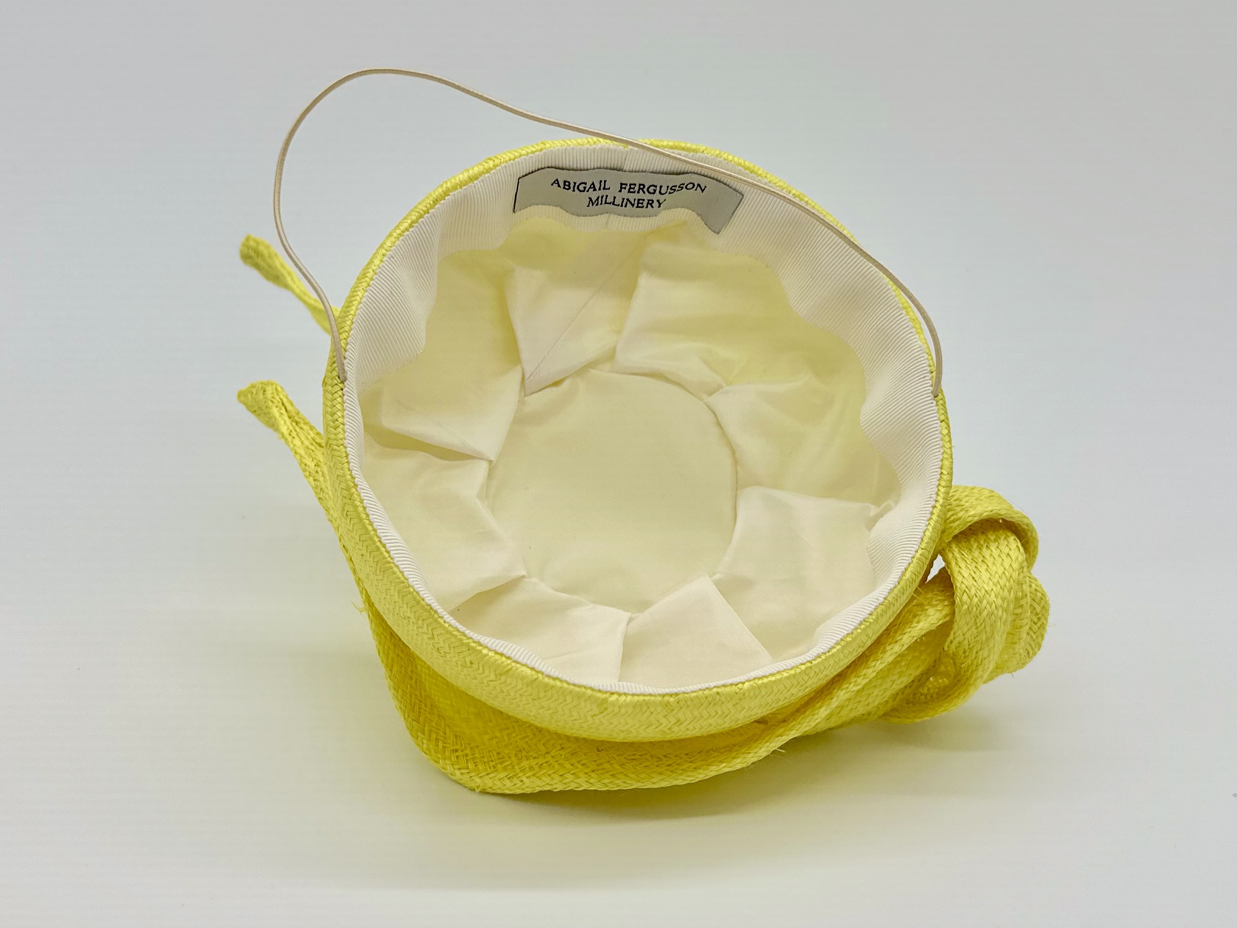 Spring Racing Millinery Racewear canary yellow parasisal straw duchess shaped cocktail hat with sculpted straw knot trim by Sydney Milliner Australian Milliner Hatmaker Abigail Fergusson Millinery