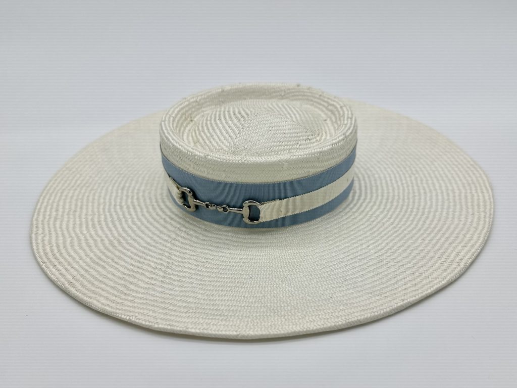 Polo In the city Urban Polo Spring racing millinery racewear white parasisal straw boater hat with porkpie crown trimmed blue and ivory hatband with silver horse snaffle stirrup saddle bit trim buckle by Australian Milliner / Sydney Milliner Hat Maker, Abigail Fergusson Millinery