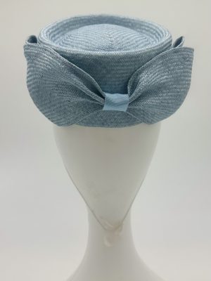 FOTF Fashions on the Field Spring Racing Millinery Racewear Hat pastel blue parasisal straw pork pie pillbox hat with matching parasisal straw bow by Australian Milliner, Abigail Fergusson Millinery, in store at The Milliner's Closet in Balgowlah in Sydney's Northern Beaches, perfect for Oaks Day, Melbourne Cup and The Everest Carnival racedays.