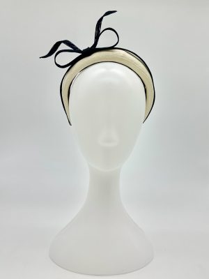 FOTF Fashions on the Field Spring Racing Millinery Racewear ivory Parasisal headband, trimmed with black sinamay sculpted bow by Australian Milliner, Abigail Fergusson Millinery, in store at The Milliner's Closet in Balgowlah in Sydney's Northern Beaches, perfect for the Derby Day, Melbourne Cup, The Everest, Magic Millions Carnivals.