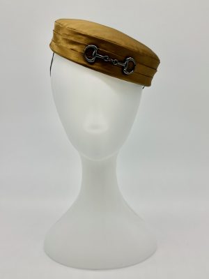 FOTF Fashions on the Field Spring Racing Millinery Racewear Hat bronze satin pillbox hat with black bow and horse snaffle bit trim by Australian Milliner, Abigail Fergusson Millinery, in store at The Milliner's Closet in Balgowlah in Sydney's Northern Beaches, perfect for Oaks Day, Melbourne Cup and Golden Slipper and Golden Eagle Carnival racedays.